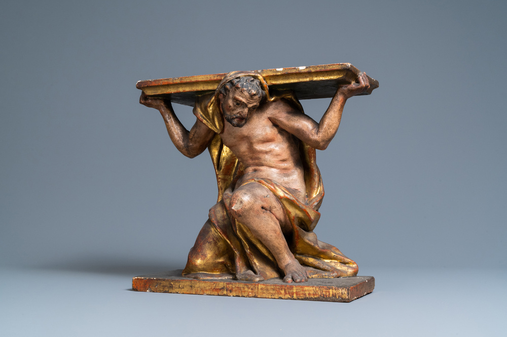 A polychromed and gilded wooden console in the shape of a kneeled Atlas figure, Italy, 17th C.