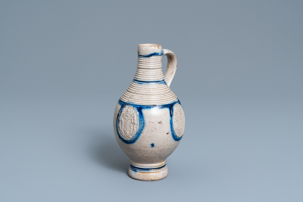 A German stoneware ewer with the Amsterdam coat of arms, Westerwald, dated 1644