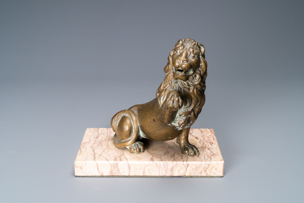 A bronze model of a lion on a marble base, 17th C.