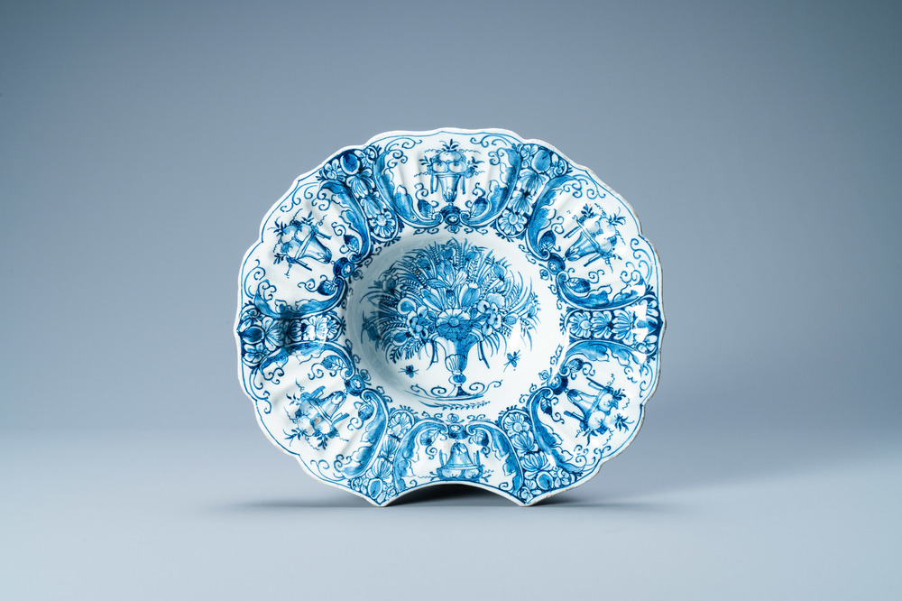 A gadrooned Dutch Delft blue and white shaving bowl, 18th C.