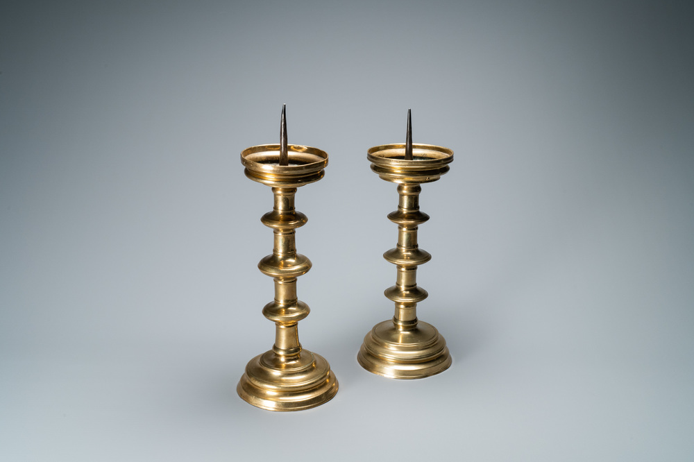 A composite pair of brass alloy candlesticks, Germany, 16th C.