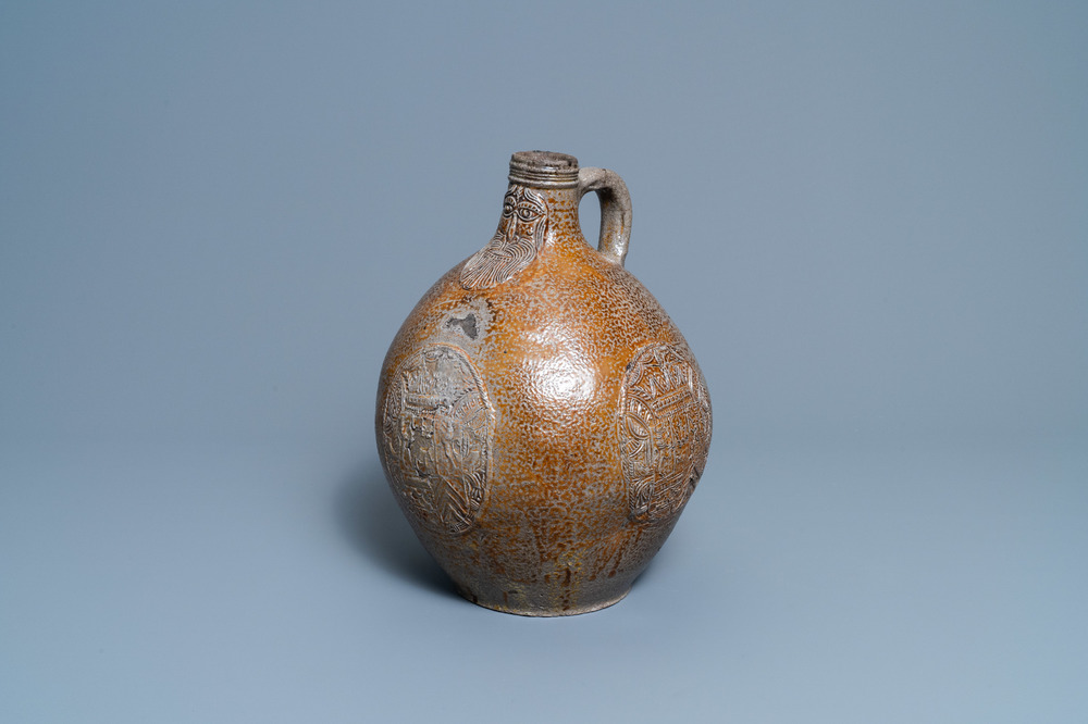 A large German stoneware bellarmine jug with three armorial medallions, Frechen, 1st half 17th C.