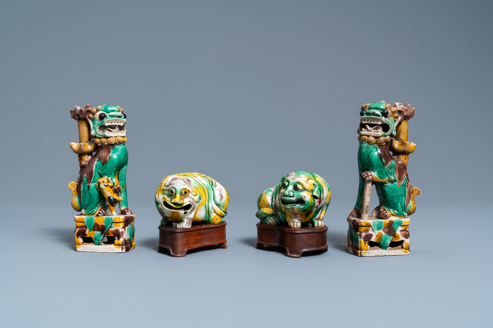 A pair of Chinese sancai models of dogs and a pair of 'Buddhist lions' joss stick holders, Kangxi