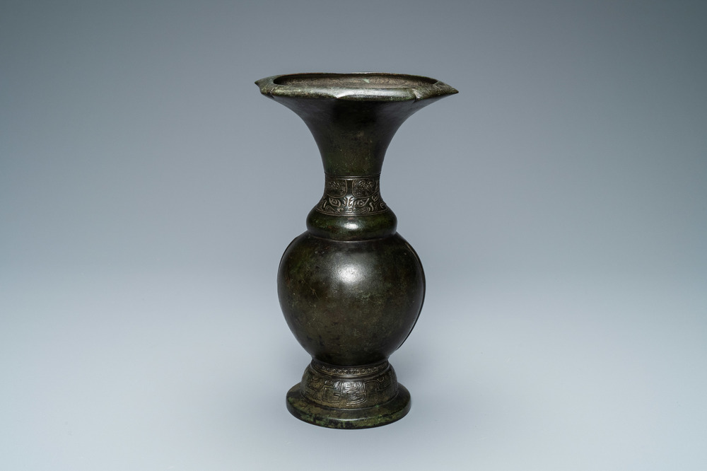 A Chinese bronze vase with incised taotie masks, Song/Yuan