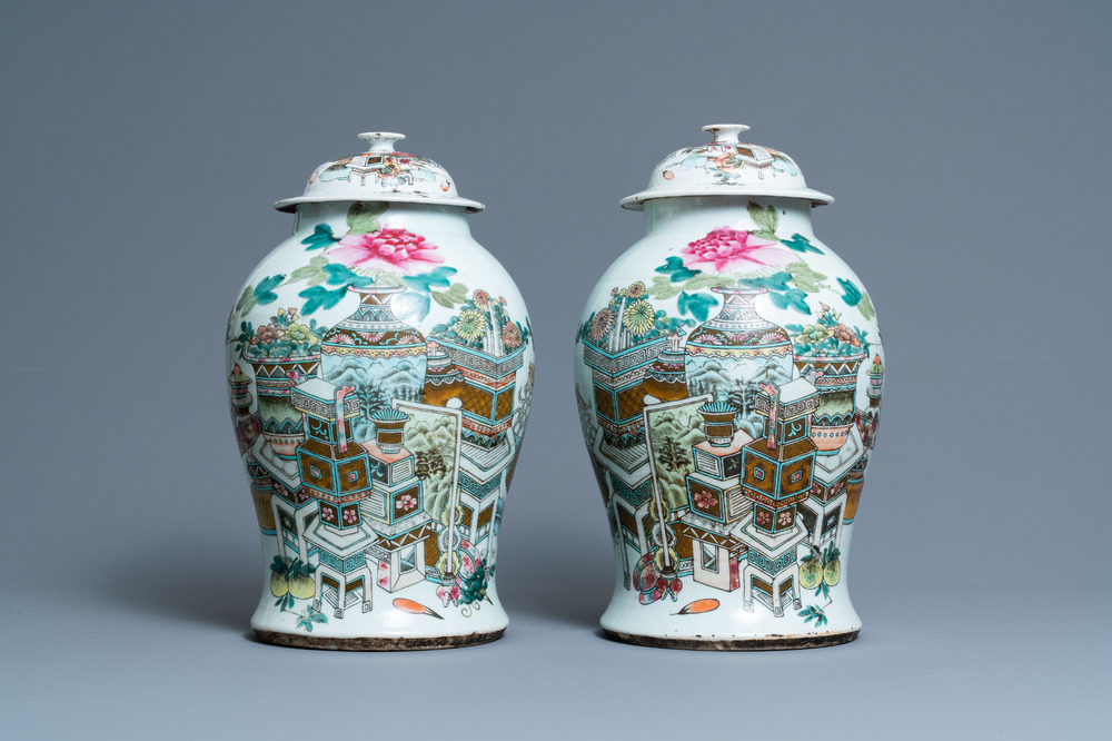 A pair of Chinese qianjiang cai vases and covers with antiquities, 19/20th C.