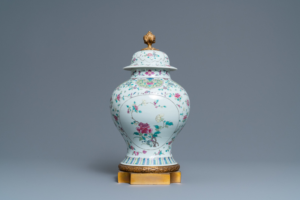 A Chinese famille rose vase and cover with gilt bronze mounts, 19th C.