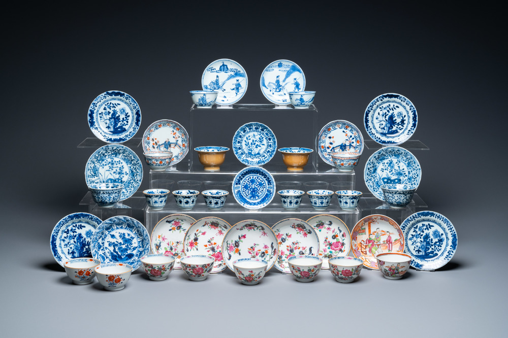 Twenty-two Chinese blue and white and famille rose cups and nineteen saucers, Kangxi and later