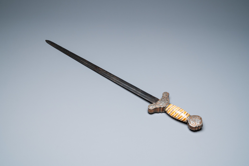 A Tibetan steel sword with silvered copper and mammoth tooth hilt, 19th C.