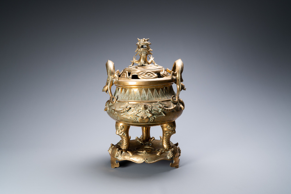 A large Chinese bronze censer and cover on stand with sea animals and shells, Qing