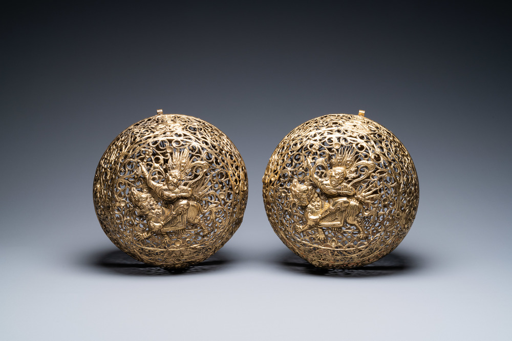 A pair of reticulated Tibetan copper incense balls, 17/18th C.