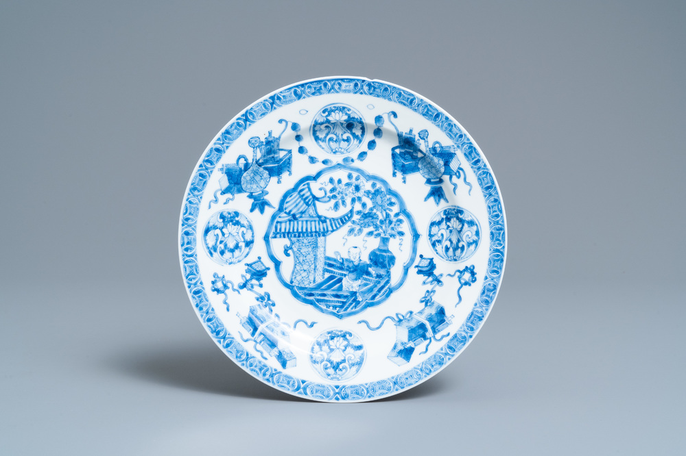 A Chinese blue and white plate with a boy surrounded by antiquities, ex-coll. August the Strong, Kangxi