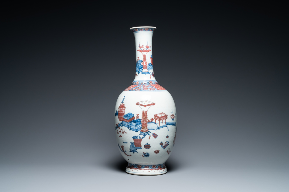 A Chinese blue, white and copper red 'antiquities' bottle vase, Qianlong