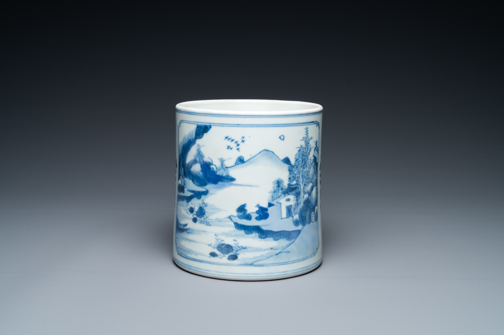 A Chinese blue and white brush pot with a landscape and antiquities, Kangxi