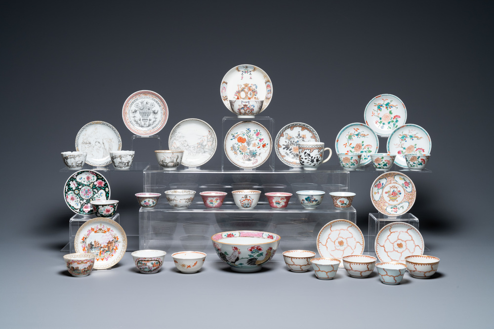 A varied collection of Chinese famille rose and grisaille cups and saucers and a 'rooster' bowl, Yongzheng/Qianlong