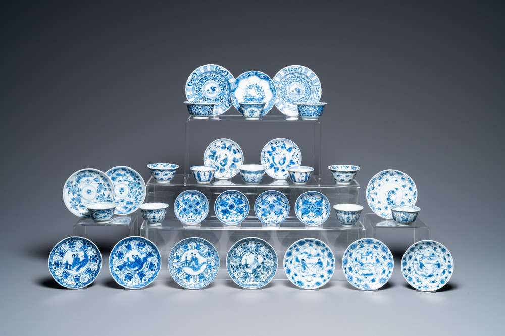 Nineteen Chinese blue and white saucers and twelve cups, Kangxi