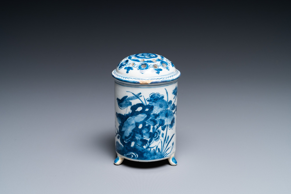 A Dutch Delft blue and white tripod caster with birds near blossoms, 1st half 18th C.