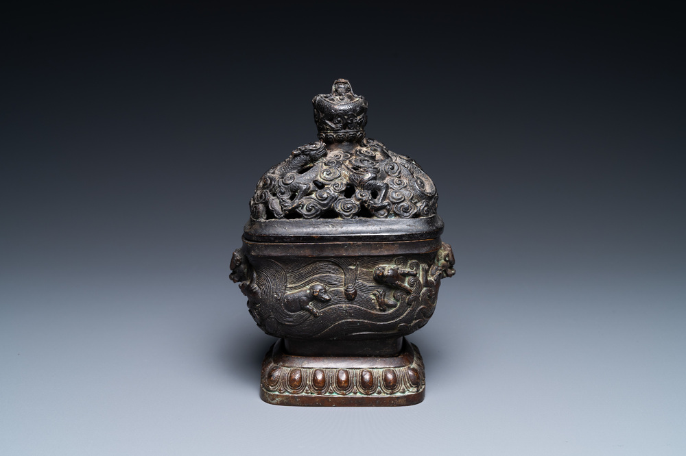 A Chinese bronze 'mythical beasts' censer and cover, 17th C.