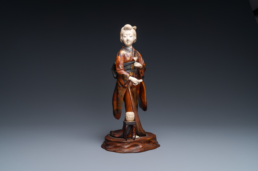 A Japanese lacquered wood, ivory and mother-of-pearl inlay 'Geisha' okimono, Meiji, 19th C.