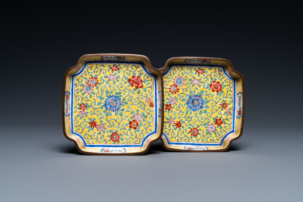 A pair of Chinese Canton enamel yellow-ground dishes, Qianlong mark, 18/19th C.