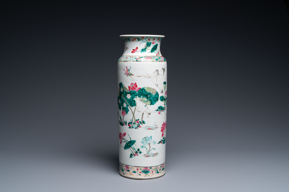 A Chinese famille rose rouleau vase with butterflies and cranes near a lotus pond, 19th C.