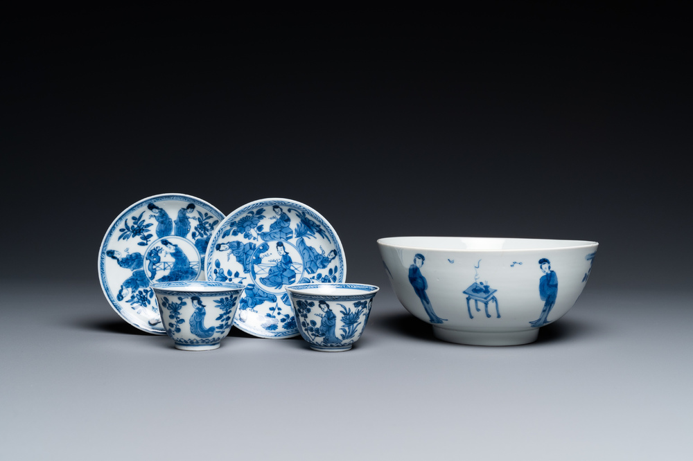 A Chinese blue and white bowl and a pair of cups and saucers, Kangxi