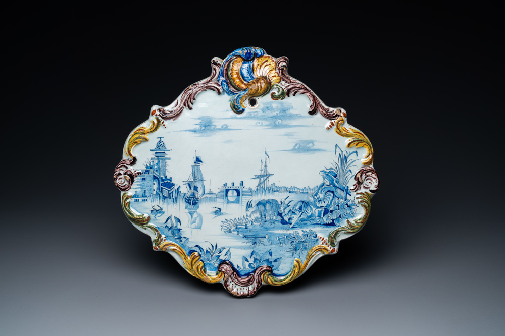 A Dutch Delft blue and white mixed technique landscape plaque, 18th C.