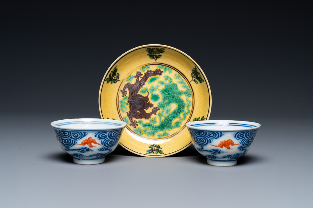 A pair of Chinese blue, white and iron-red cups and a yellow-ground 'dragon' dish, Guangxu mark and of the period