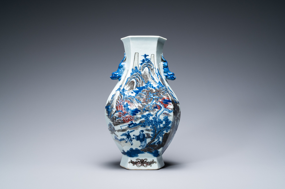 A Chinese blue, white and copper-red 'mountainous landscape' vase, 19th C.