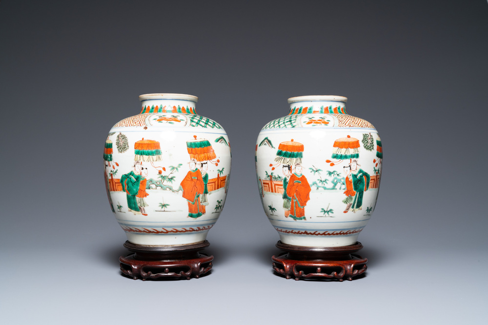 A pair of Chinese famille verte vases on wooden stands, 'hare' mark, 19th C.