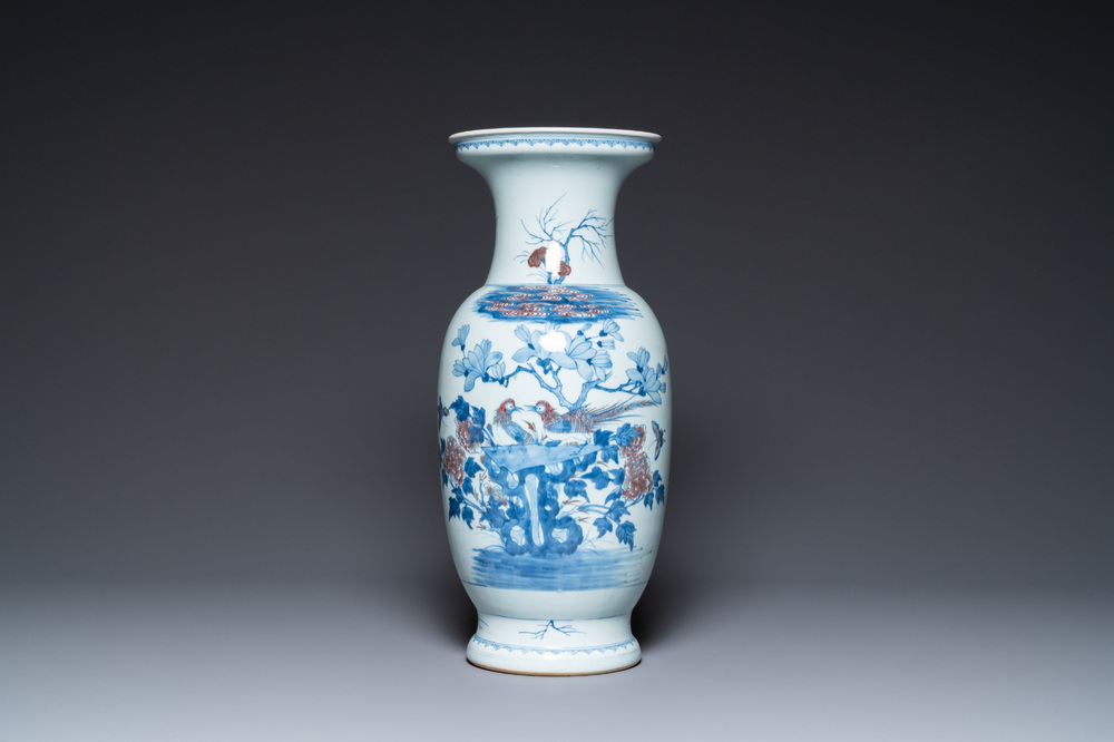 A Chinese blue, white and copper-red vase, 18/19th C.