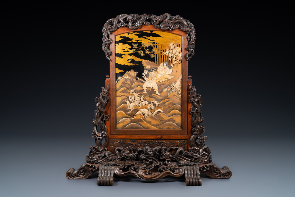 A large Japanese wooden screen with a central gilt-lacquered and ivory-inlaid panel, Meiji