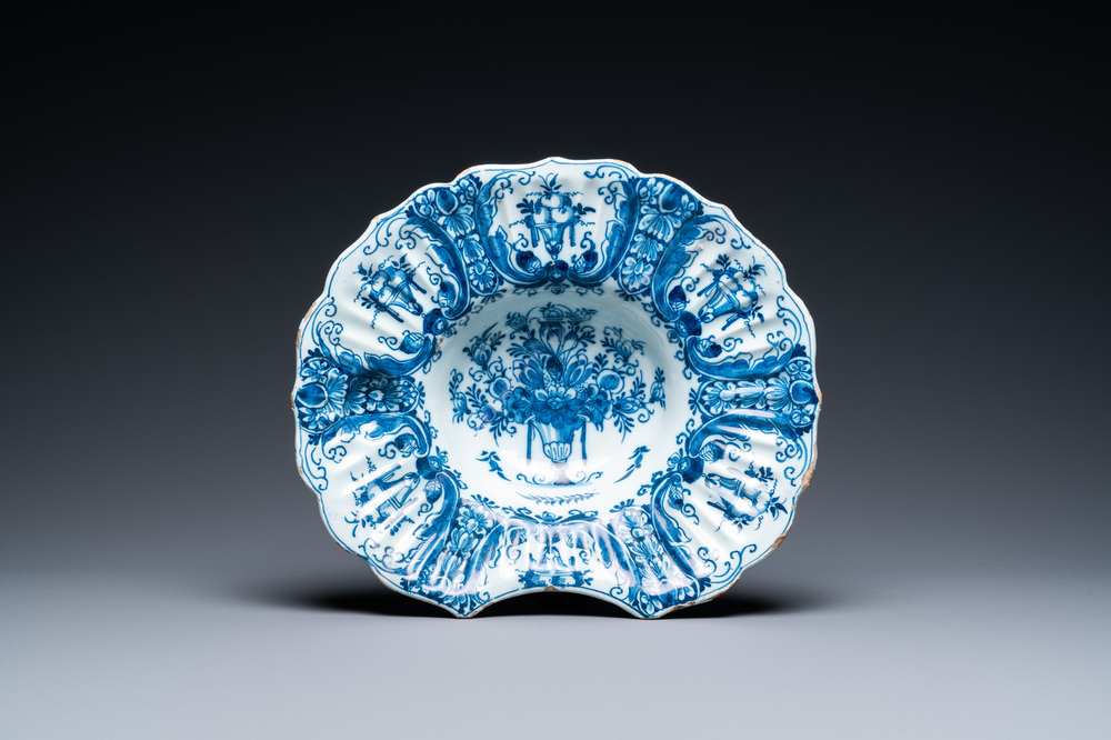 A gadrooned Dutch Delft blue and white shaving bowl, 18th C.