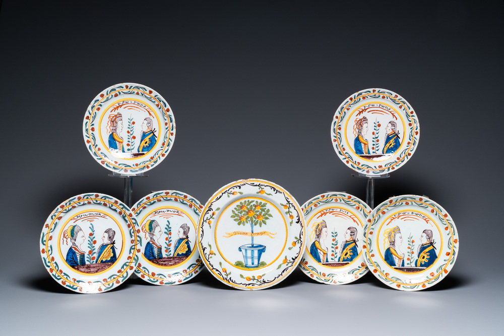 Six polychrome Dutch Delft orangist royal portrait plates and an 'Orange tree' dish, 18th C.