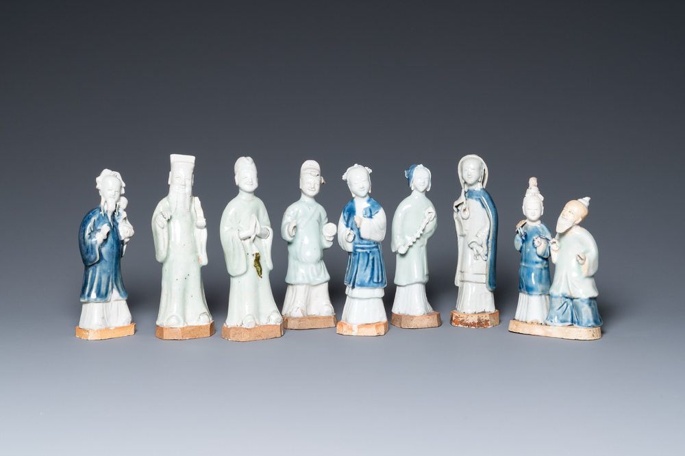 Eight Chinese blue, white and celadon-glazed figures, Qianlong