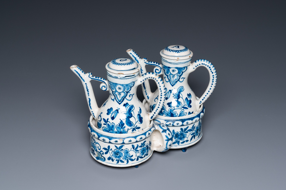 A Dutch Delft blue and white cruet set on stand, 18th C.