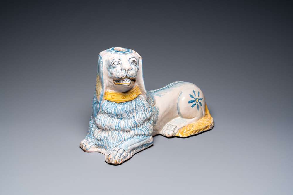 A large blue, white and yellow model of a recumbent lion, Nevers, France, 17th C.