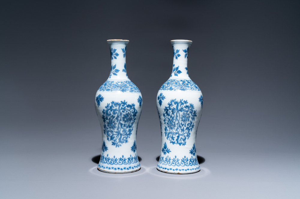 A pair of Dutch Delft blue and white bottle vases with floral design, late 17th C.