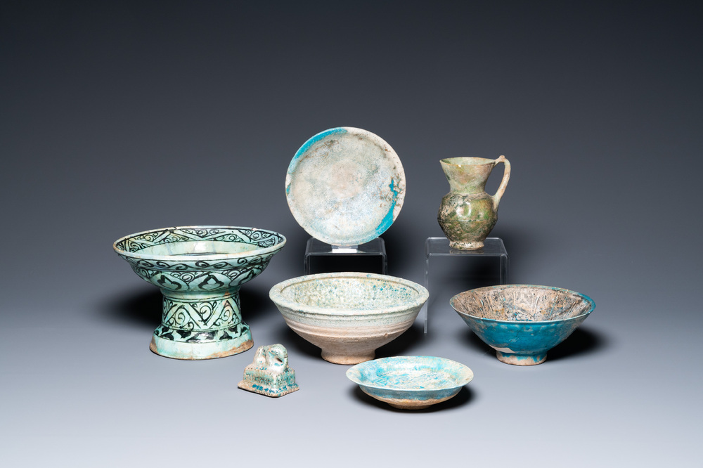 Two turquoise- and black-glazed dishes, three bowls, a jug and a small lion, Raqqa and Nishapur, Middle-East, 12/13th C. and later