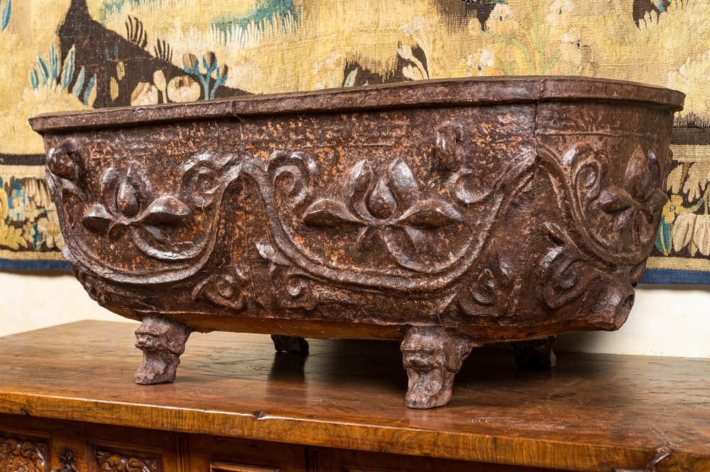 A large Chinese cast iron jardini&egrave;re on four lion feet, 19th C.