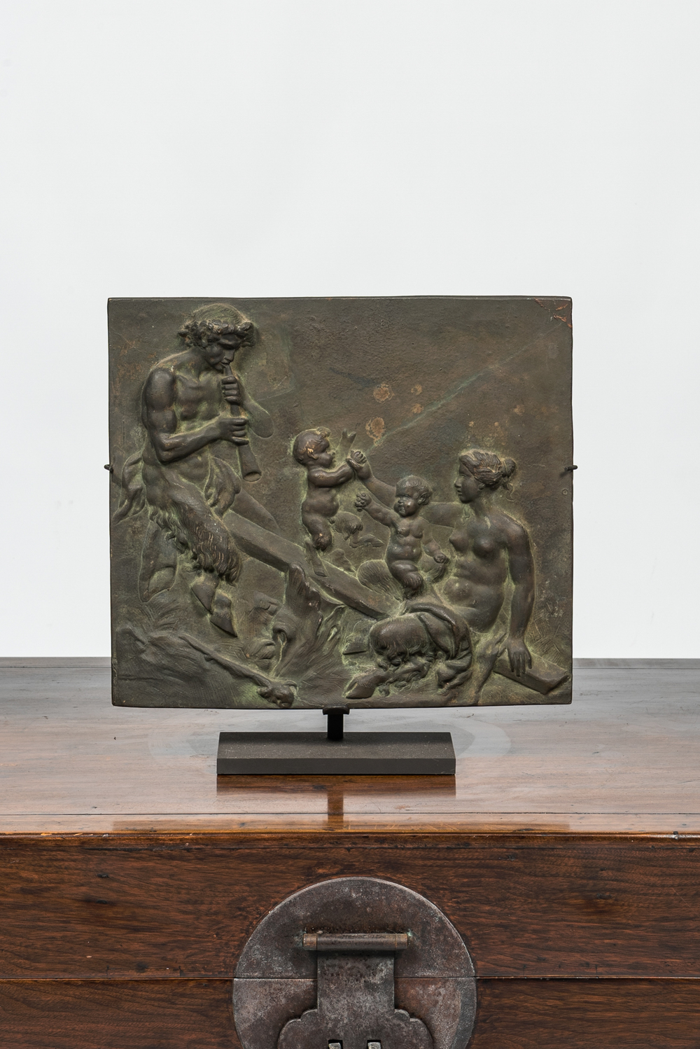 A French patinated bronze relief with a family of satyrs on a seesaw, 19th C.