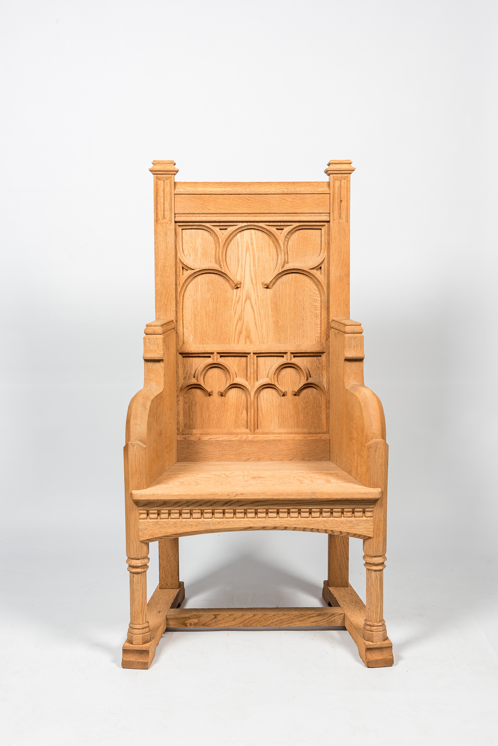 A French Gothic Revival white oak wooden armchair, 20th C.