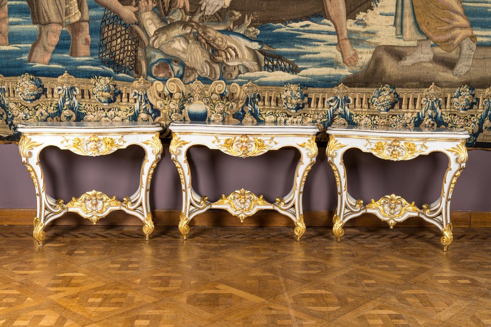 A pair of painted and gilt wooden rocaille console tables and a jardini&egrave;re, France, 19/20th C.