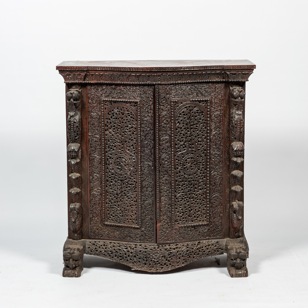 An Anglo-Indian colonial carved wooden two-door cabinet, 19th C.