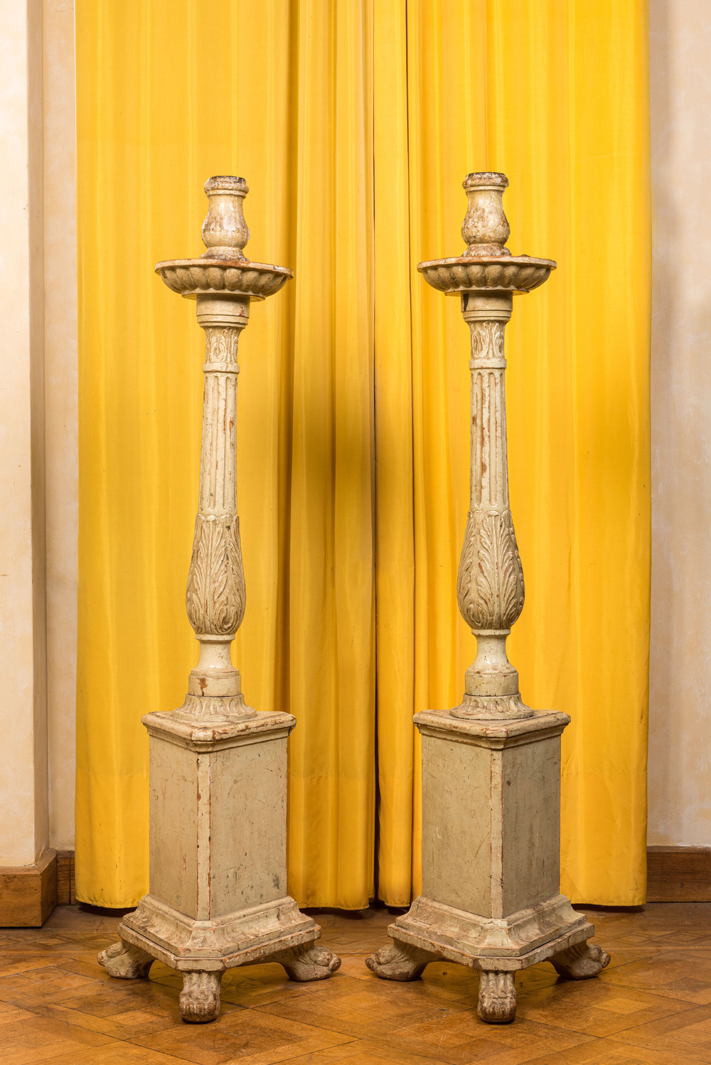 A pair of large painted wooden candle holders, Italy, 18/19th C.