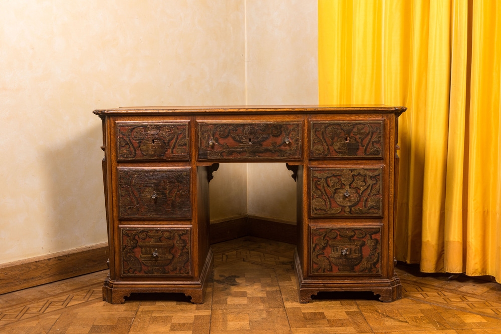 A wooden desk with six drawers with painted panels, 19th C.