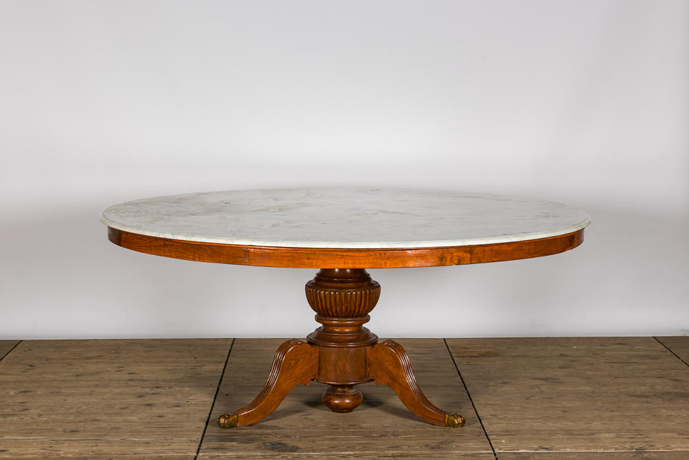 A large round French tripod Louis Philippe table with a white marble top, 19th C.