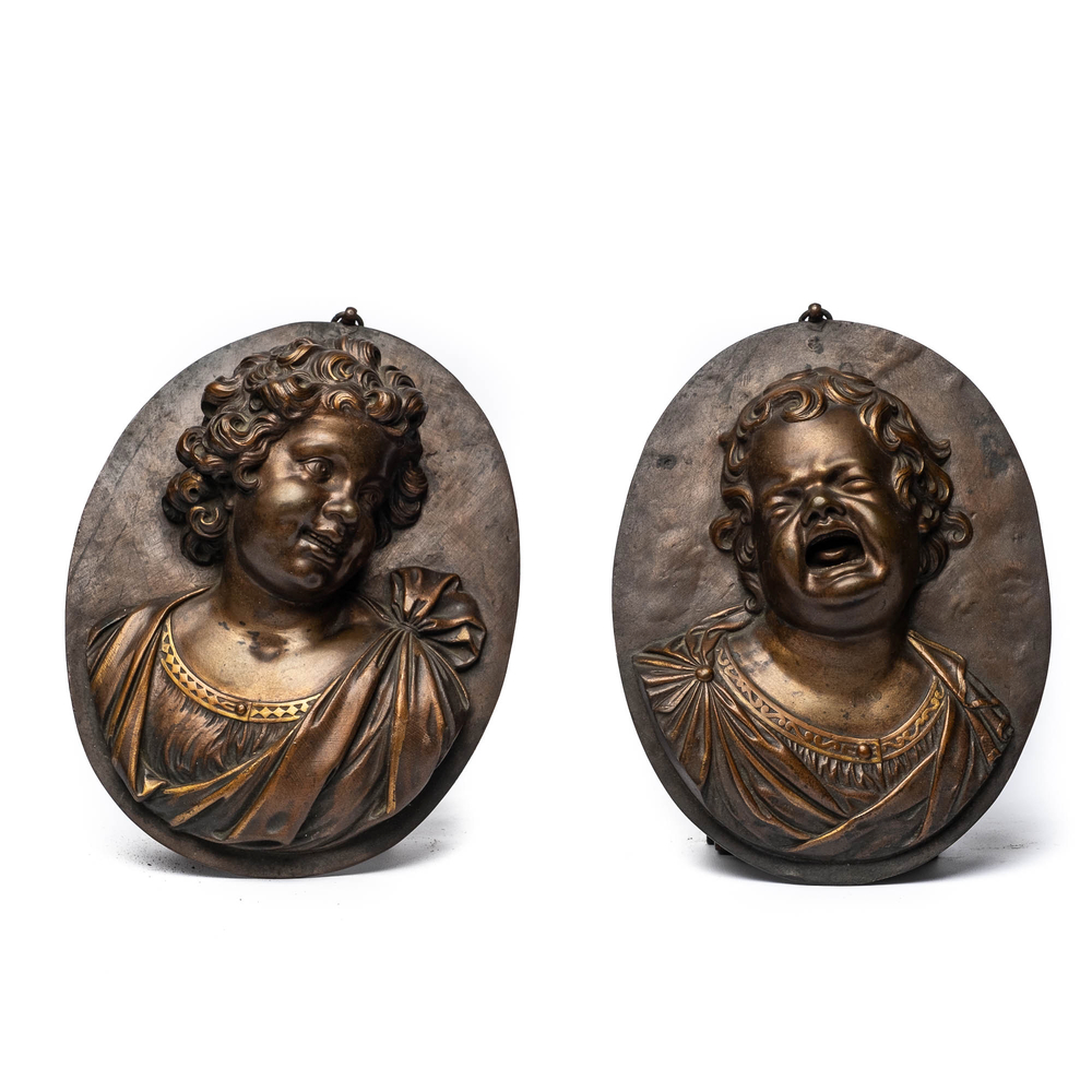 After Louis-Fran&ccedil;ois Roubiliac (1702/05-1762): A pair of bronze plaques depicting 'The laughing child' and 'The crying child', 19th C.