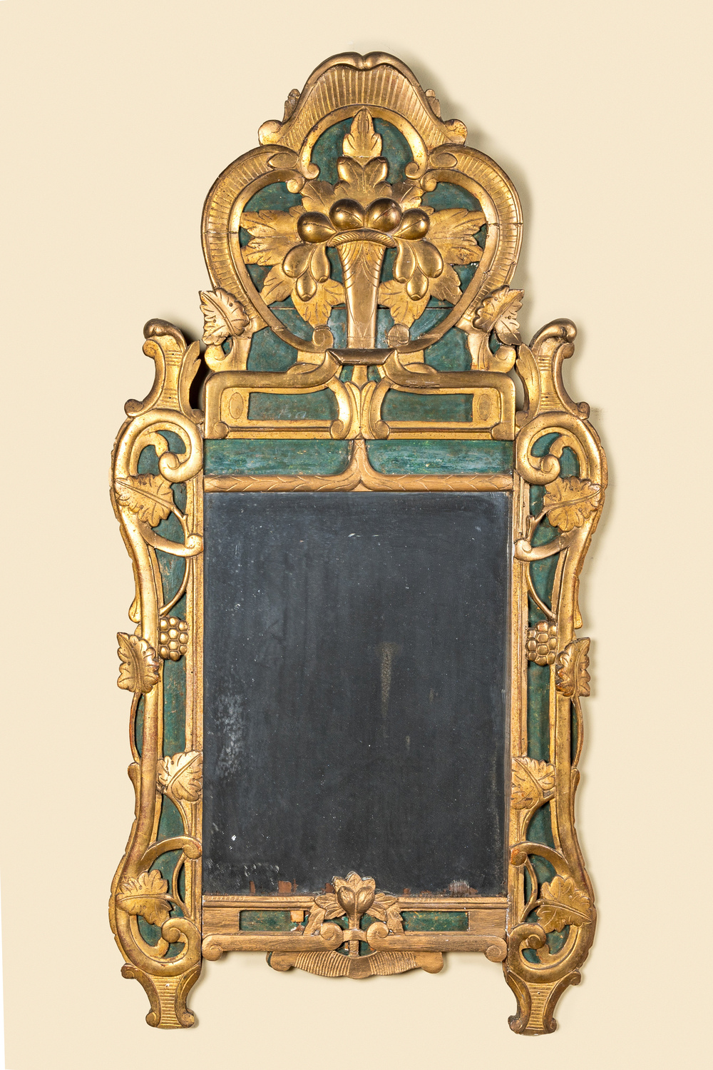 A French gilt wooden mirror with floral design, 19th C.