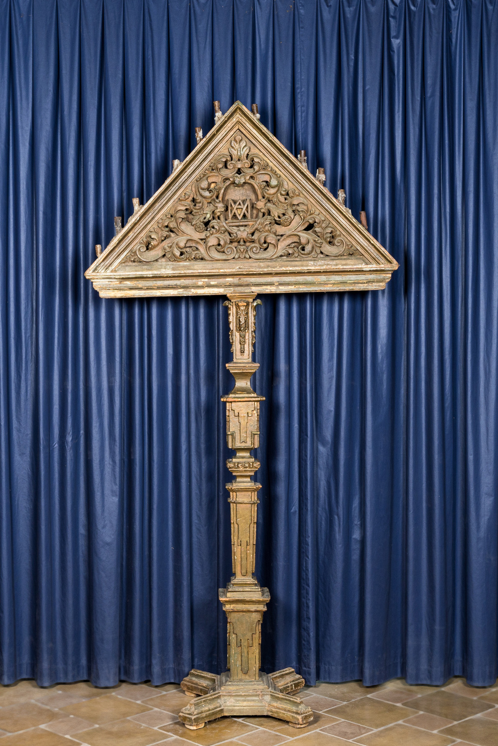 A massive patinated wooden 'tenebrae' church candlestick, 18th C.