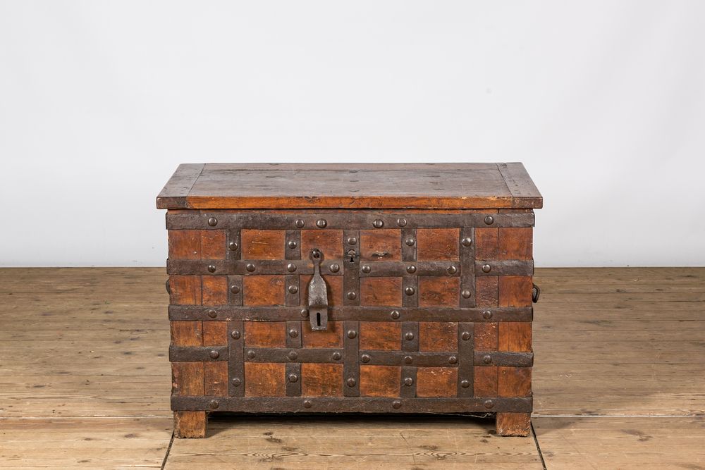 A wrought iron-mounted wooden coffer, 17th C.